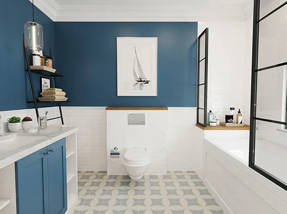 Renovated bathroom with blue walls and modern fixtures, showcasing remodeling of our bathroom services.