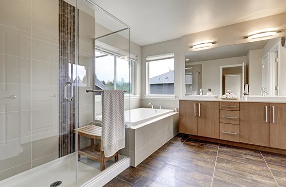 Spacious bathroom with dual sinks and mirrors, featuring custom bathroom design services in Rockville, MD.
